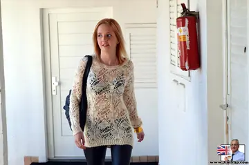 Slim Blonde Peels Off Leather Pants and Spreads Her Shaved Pussy