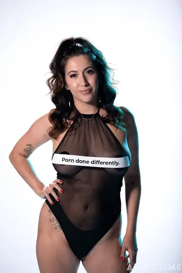April ONeil – Busty Latina Strips Out of Her Sheer Bodysuit in Heels
