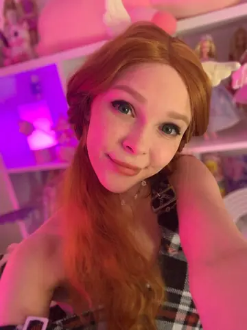 Kitty Gem – Tall Redhead in Pigtails Strips Out of Her Fishnet Lingerie