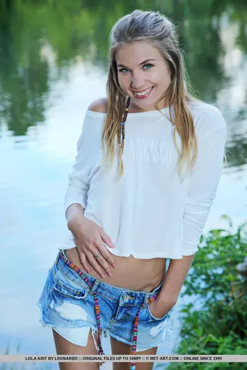 Slim European Brunette Spreads Her Shaved Pussy by the Pond