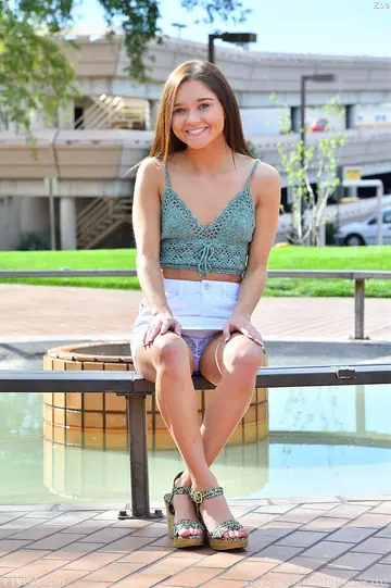 Zoe Bloom – Brunette Flashes White Panties in a Short Skirt Outdoors