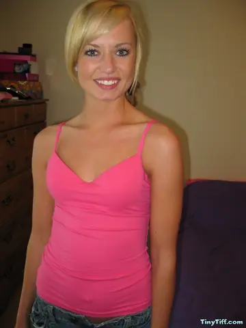 Thick Blonde Lowers Shorts and Panties to Show Her Shaved Pussy