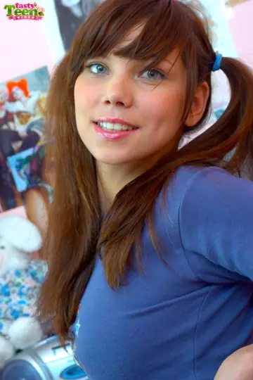 Tall Brunette in Pigtails Lowers Pink Fishnets and Fingers Her Pussy