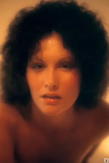 Mature Brunette with Short Hair Fingers Her Pussy on the Bed