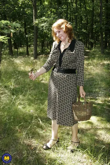 Mature Redhead European Woman Gives a Blowjob Outdoors