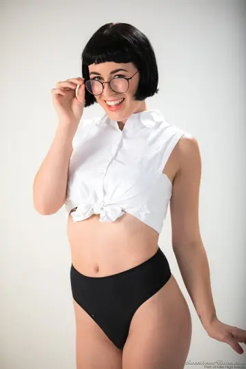 Olive Glass – Short-Haired Brunette Removes Glasses and Poses Naked