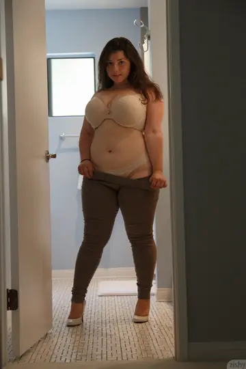 Brunette BBW Strips Off Her Sheer Lingerie to a Thong