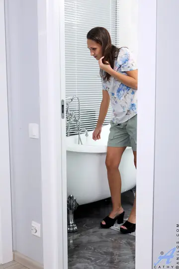 Petite Brunette Shows Her Hairy Pussy and Ass in the Bathroom