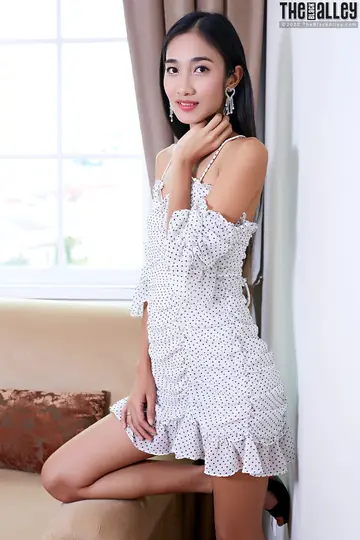 Slim Asian Woman Spreads Her Pussy in a Skirt and Heels