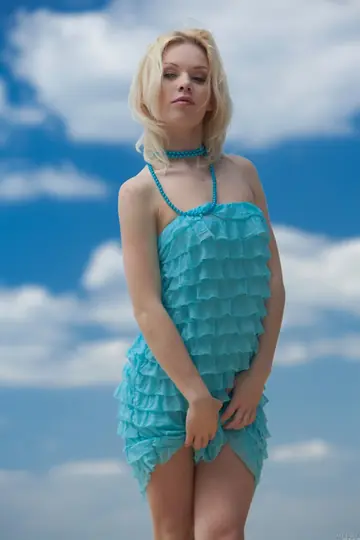 Petite Blonde Strips Out of Her Dress on the Beach