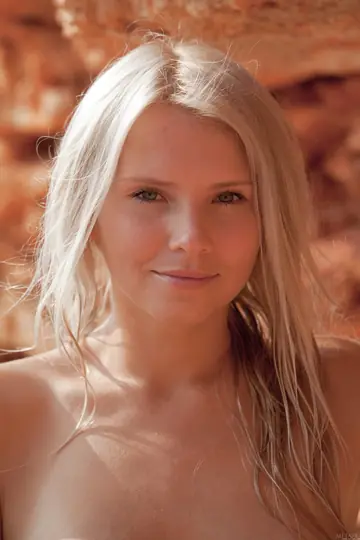 Tall Blonde Poses Nude on the Beach