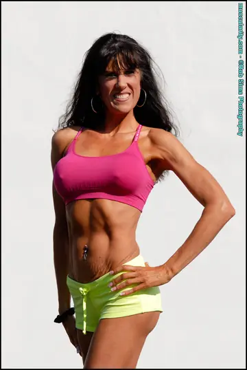 Muscular MILF with Big Tits Strips Off Her Bikini Top on the Beach