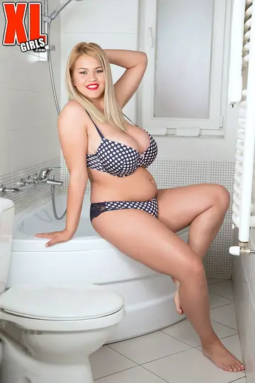 Busty Blonde BBW Strips Out of Her Bikini in the Bathroom
