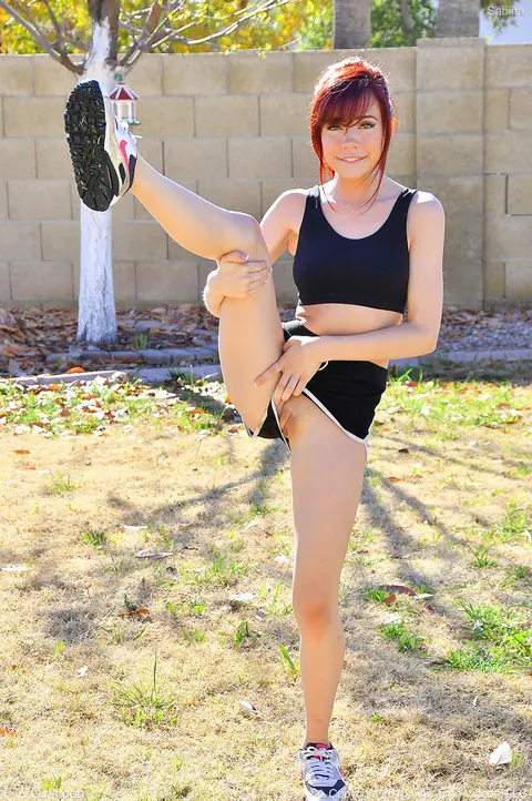 Sabina Rouge: Skinny Redhead Strips Out of Her Shorts for Nude Yoga Outdoors – photo 3 of 15