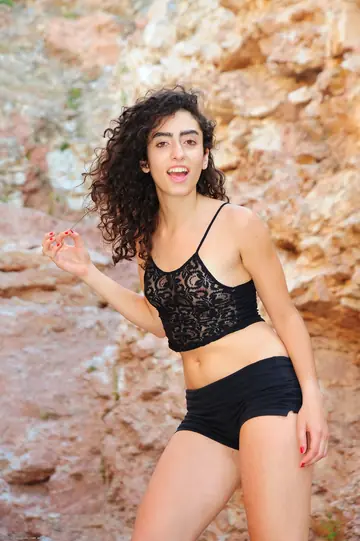 Tall Curly Woman Strips Naked and Spreads Her Hairy Pussy Outdoors