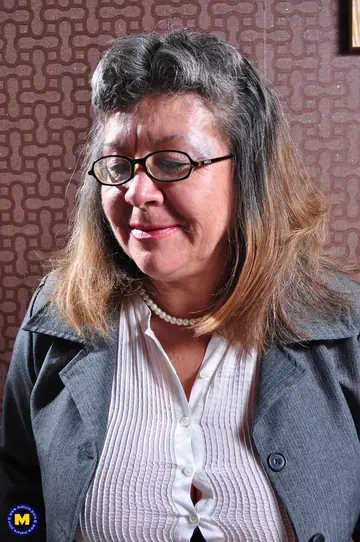 Busty MILF in Glasses Fingers and Spreads Her Pussy