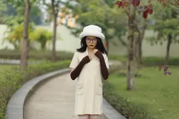 Petite Asian Woman in Glasses Undresses Outdoors
