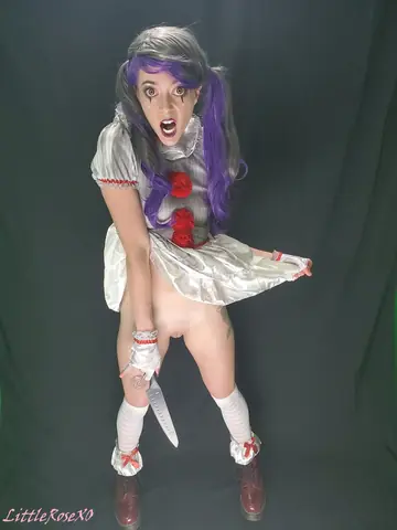 Woman in Costume and Stockings Spreads Her Shaved Pussy