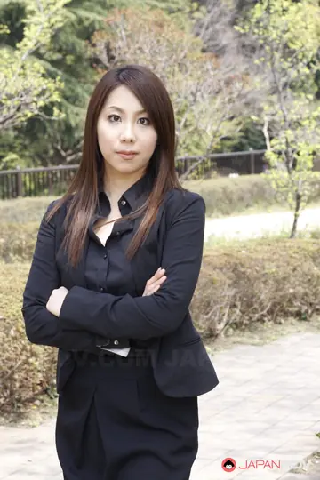 Asian Brunette Adjusts Her Skirt and Glasses Outdoors