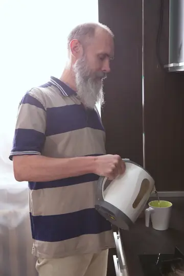 Inked Brunette Sucks and Fucks a Bearded Man in the Kitchen