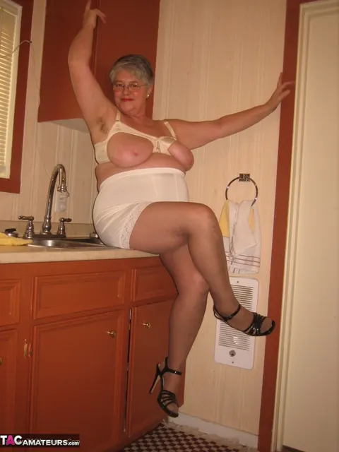 Curvy Short-Haired MILF Strips Off Her Lingerie in the Kitchen – photo 14 of 20