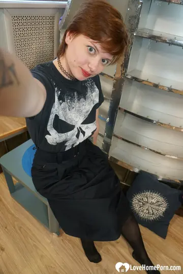 Short-Haired Redhead in Stockings Poses for a Selfie