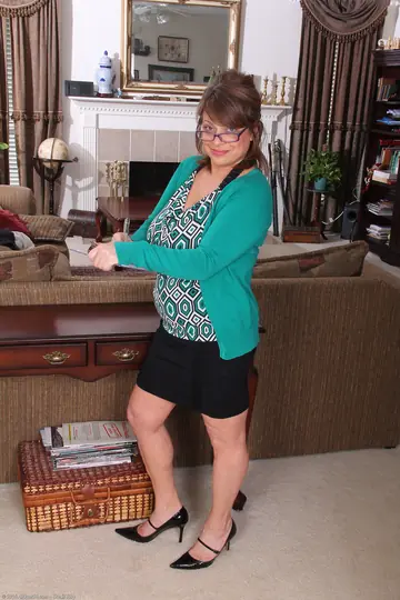 Mature Brunette Undresses and Spreads Her Shaved Pussy