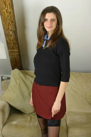 Thick Brunette with Big Tits Poses in Stockings and a Skirt