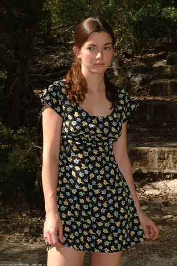 Amateur Brunette in Pigtails Undresses Outdoors and Spreads