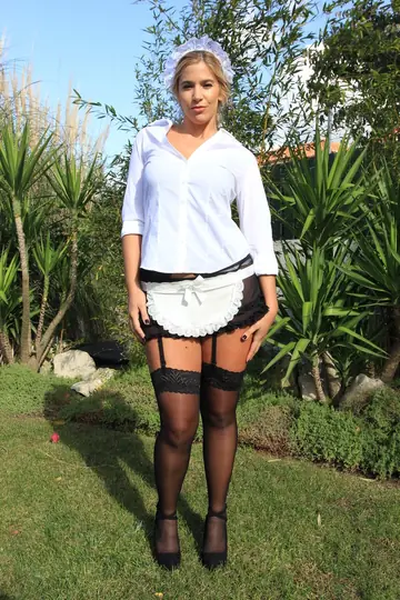CAROL FERRER – Blonde MILF Maid Shows Off Her Bubble Butt in Stockings Outdoors