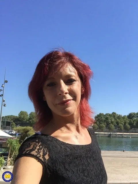 Morgane Dell: Redhead MILF in a Skirt Poses Outdoors and Flashes Her Body – photo 16 of 16