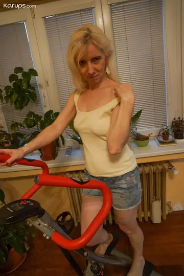 Blonde MILF Strips Out of Her Shorts and Fingers Her Hairy Bush
