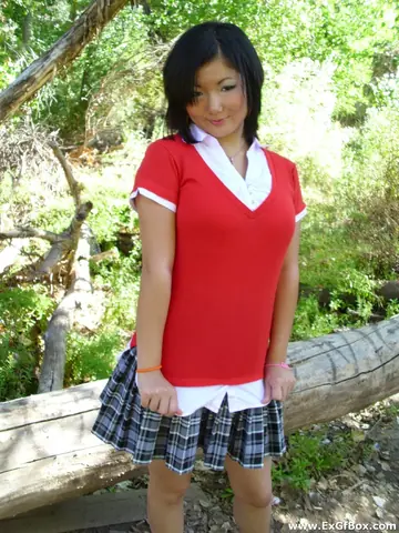 Slim Asian Woman Strips Nude and Poses Outdoors