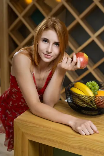 Petite Redhead Peels Off Her Dress on a Kitchen Table
