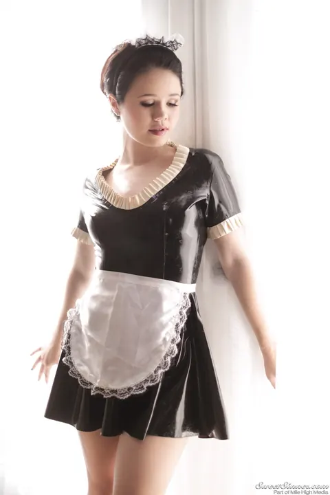 Yhivi: Brunette Maid Strips Off Her Latex Uniform by the Window – photo 3 of 15