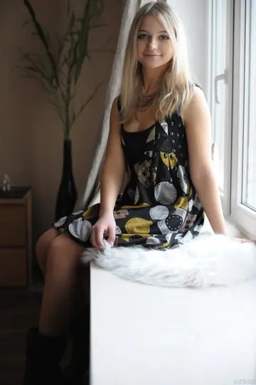 Blonde Removes Her Boots to Show Her Hairy Pussy in a Dress and Stockings