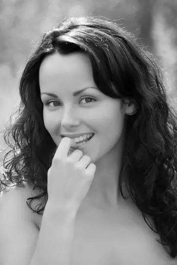Curly Brunette with Big Natural Tits Shows Her Hairy Bush in the Forest