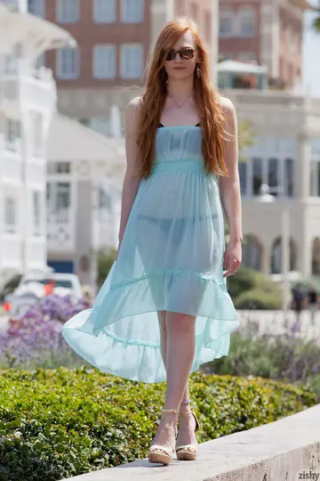 Bree Abernathy – Redhead in Glasses Walks Outdoors in a See-Through Dress