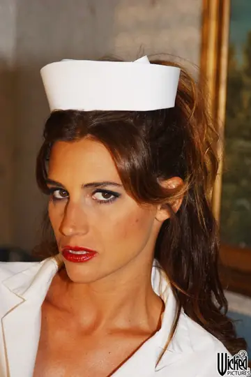 Nurse Strips Out of Her Uniform and Spreads in Panties