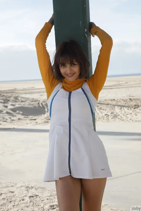 Basil Navas: Petite Brunette Flashes Her Skirt on the Public Beach – photo 5 of 12