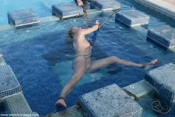 Jenny Lee – Tall Brunette MILF Bound in Bondage Restraints by the Pool