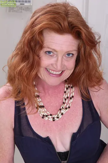 Mature Redhead with Big Tits Undresses and Spreads Her Pussy