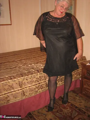 BBW in Glasses Strips Out of Her Lingerie and Spreads Her Legs in Stockings