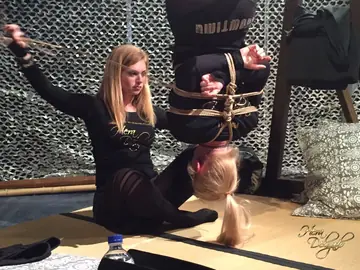 Blonde Hangs Upside Down in Rope Bondage