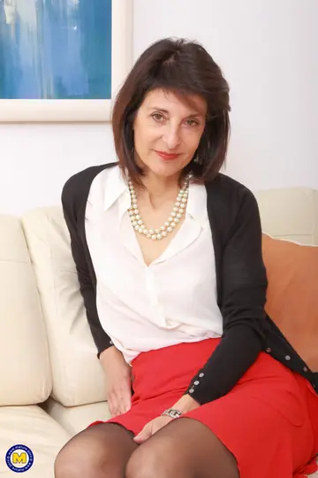 British MILF Peels Clothes for Lingerie and Stockings on the Sofa