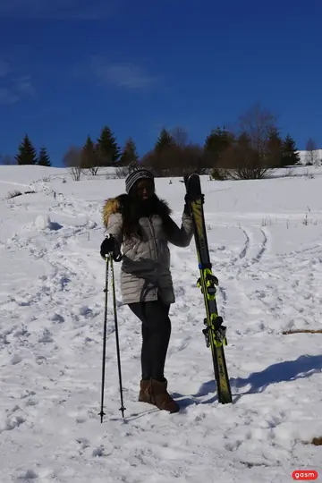 Sunny Star – Ebony Brunette Models a Ski Outfit in the Snow