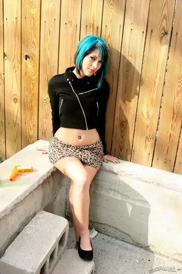 Slim Short-Haired Woman Spreads Her Legs Outdoors