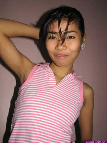 Skinny Asian Babe Slips Off Her Panties and Spreads