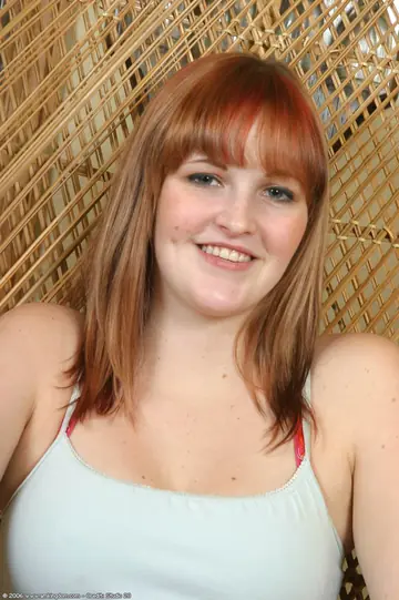 Slim Redhead in Lingerie Strips and Spreads Her Trimmed Pussy