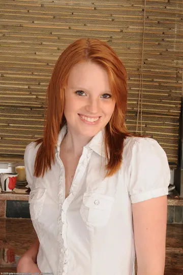 Katey Grind – Skinny Redhead Undresses and Poses Nude Showing Her Tattoos